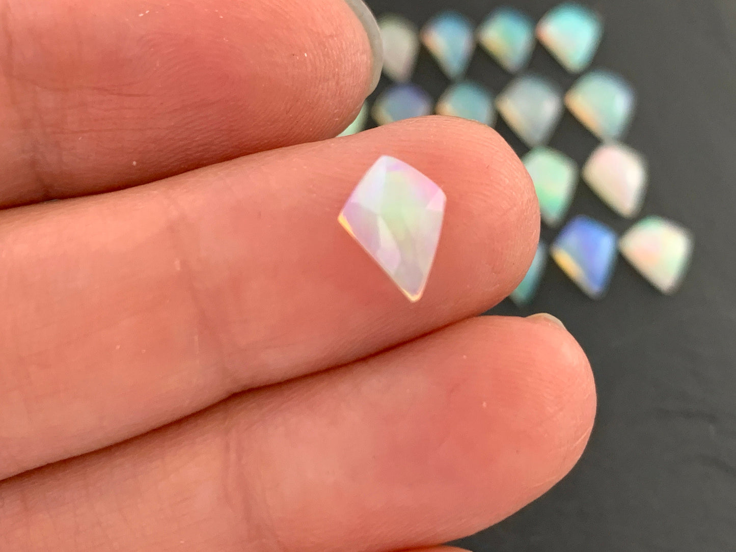 Faceted Welo Opal kite 7x9mm cabochon