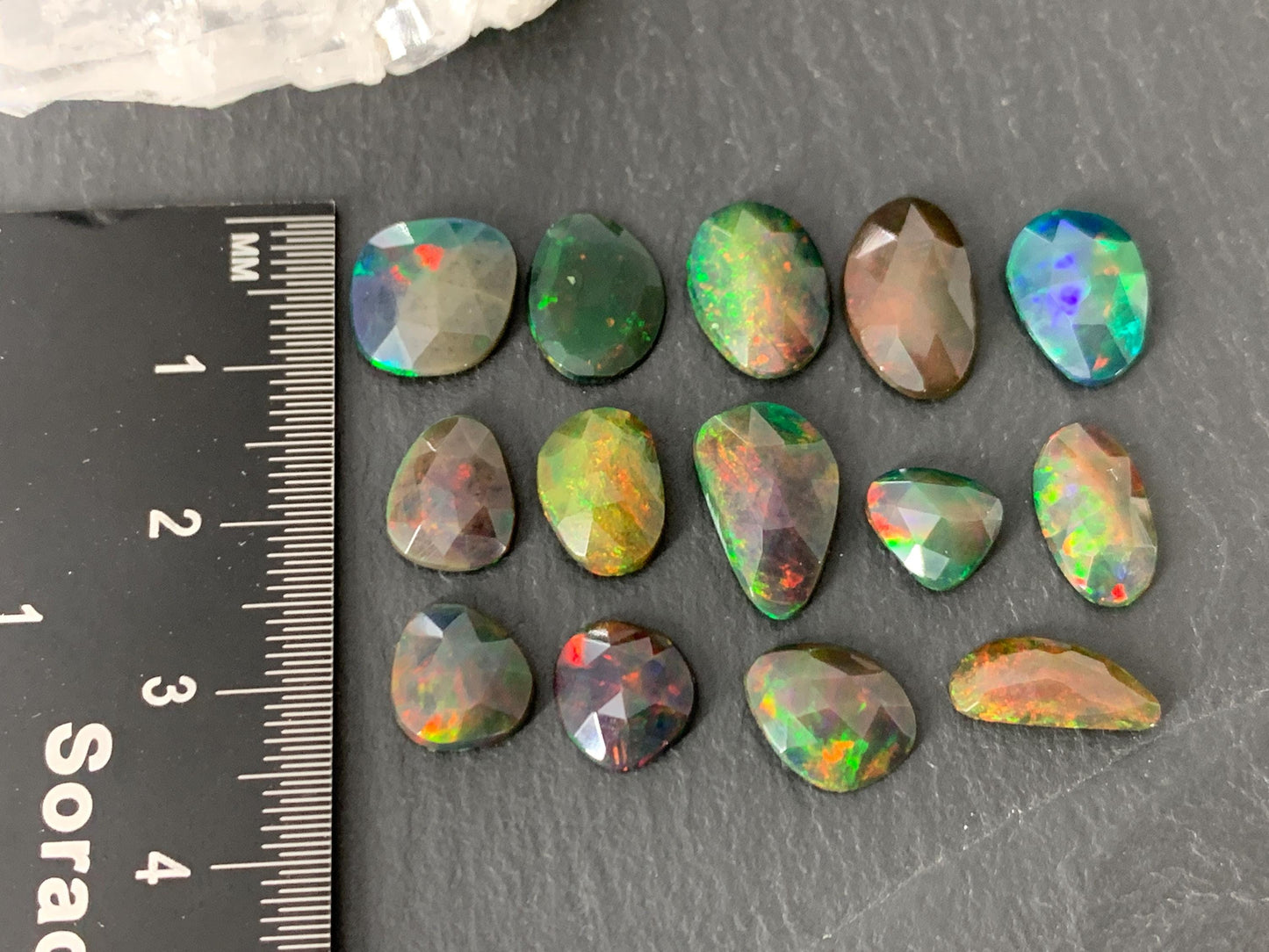 Faceted black Ethiopian Opal 8-12mm long cabochon