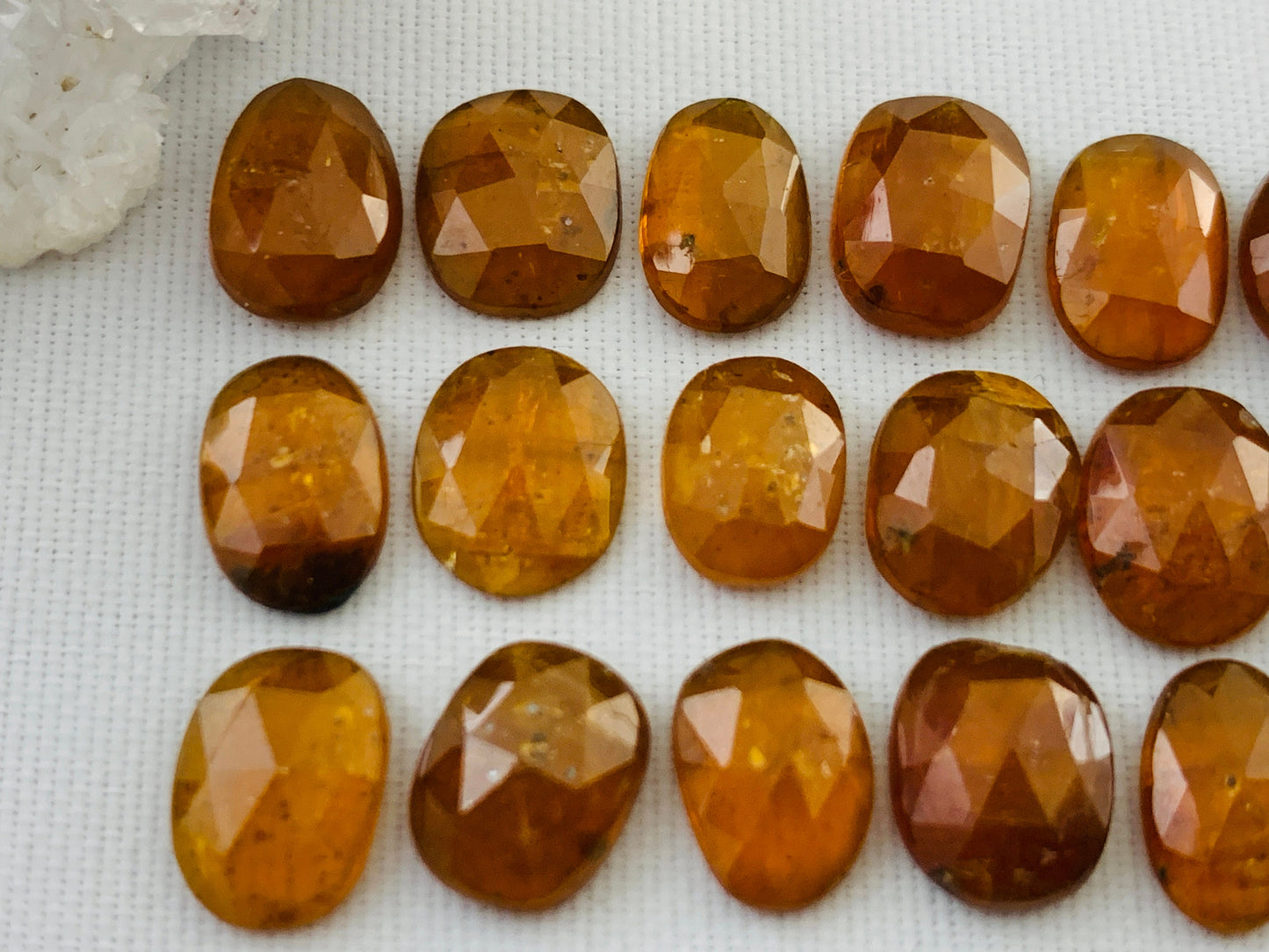 Faceted Orange Kyanite oval 9-10mm long cabochon