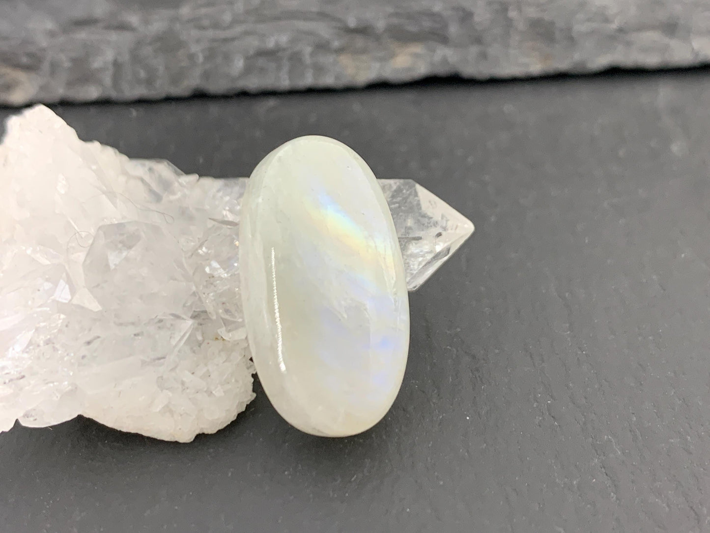 Rainbow Moonstone oval 23x12x7mm cabochon