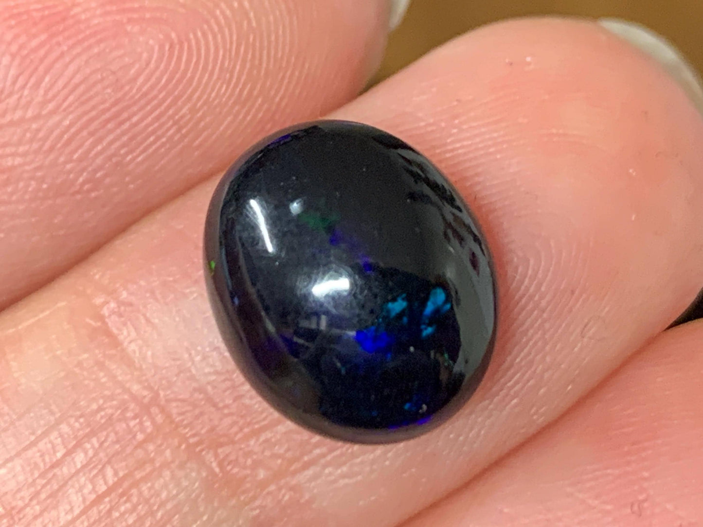 Natural Ethiopian Black Opal 10x12x5mm cabochon