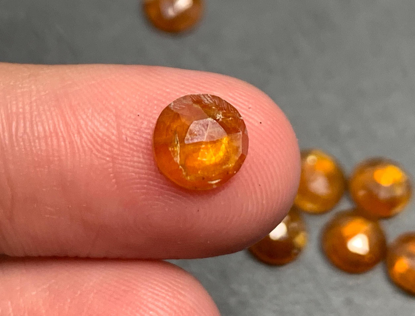 Damaged - faceted orange Kyanite round 7mm cabochons