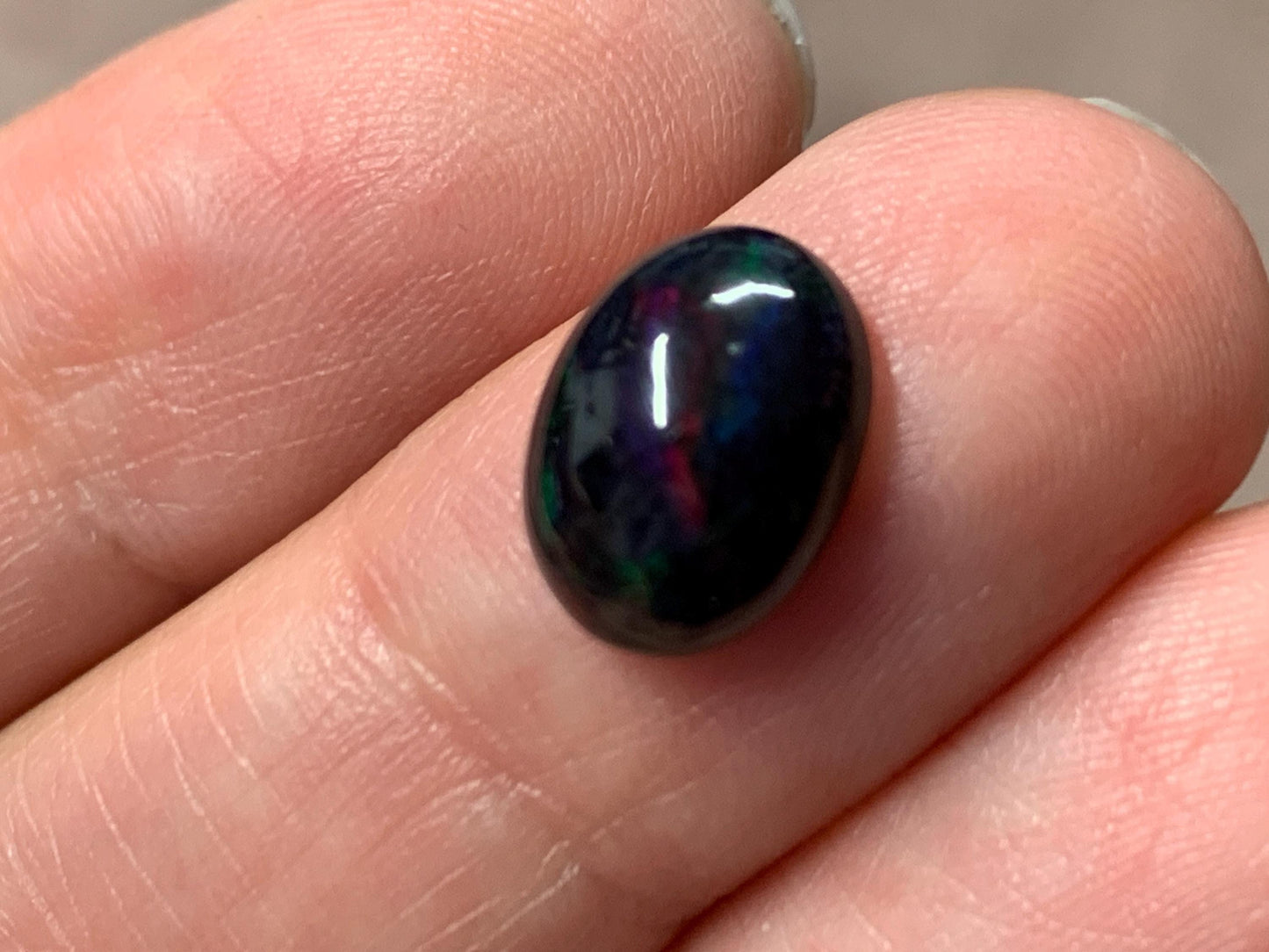 Black Ethiopian Opal oval 8x11x5mm cabochon