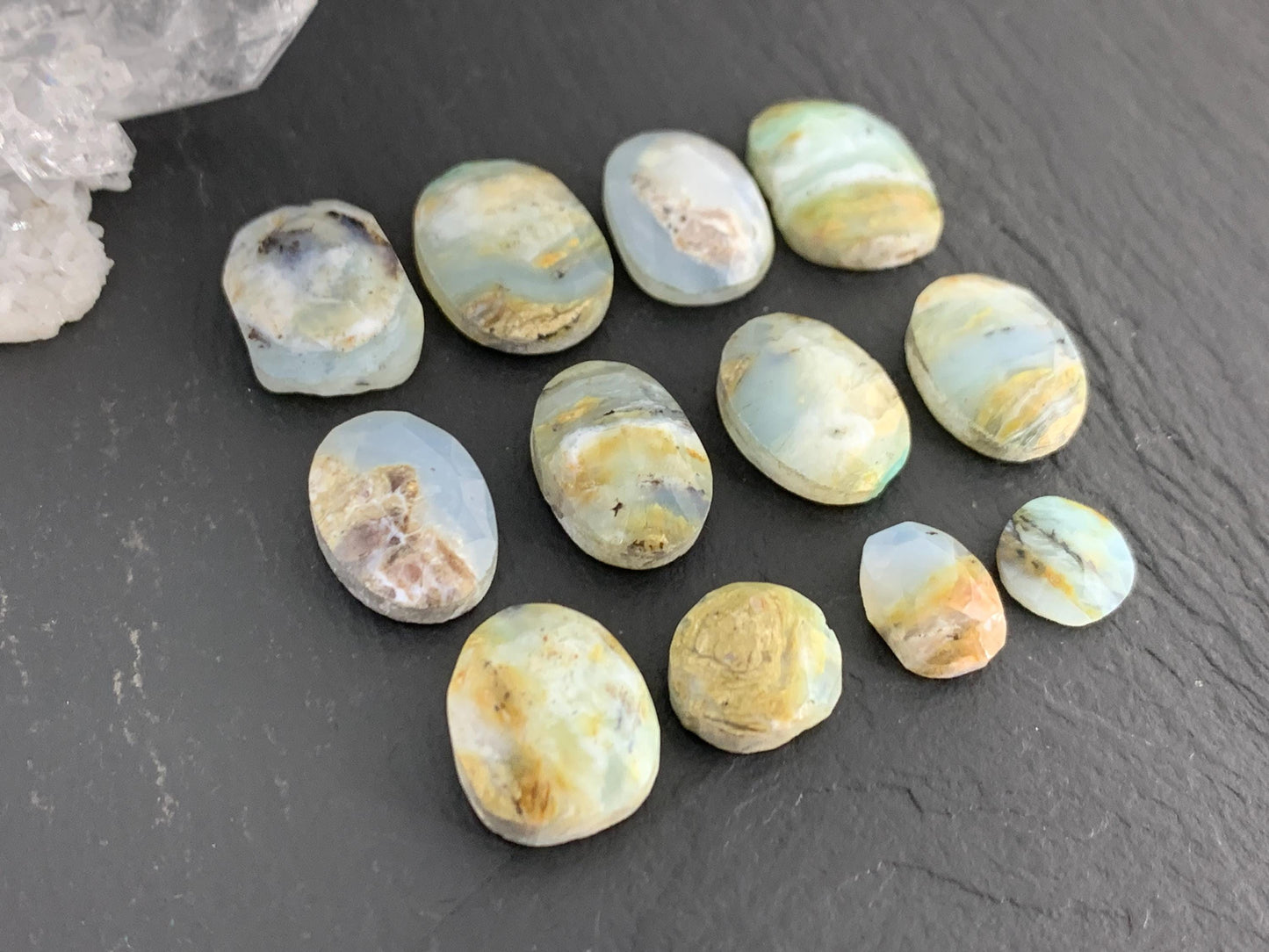 Faceted Peruvian Opal 8-14mm long cabochon.
