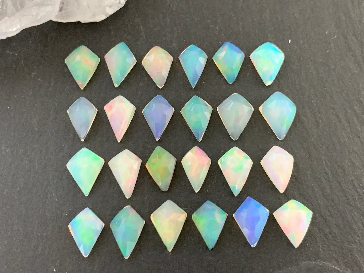 Faceted Welo Opal kite 7x9mm cabochon