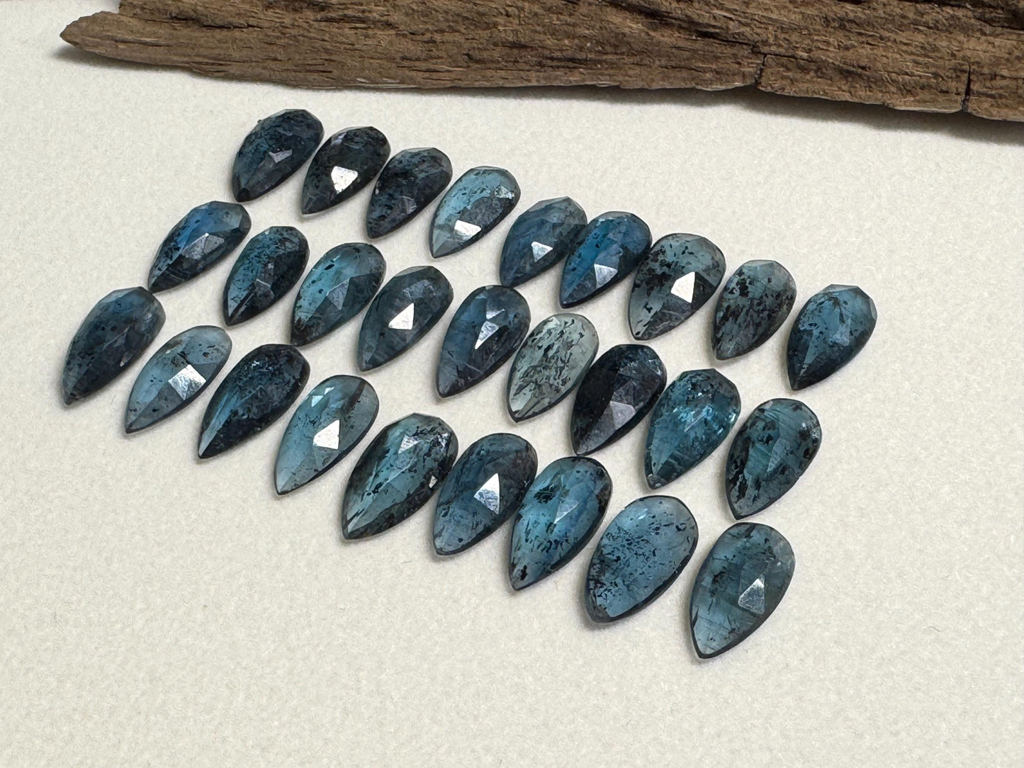 Faceted Moss Kyanite pear 7x15mm cabochon