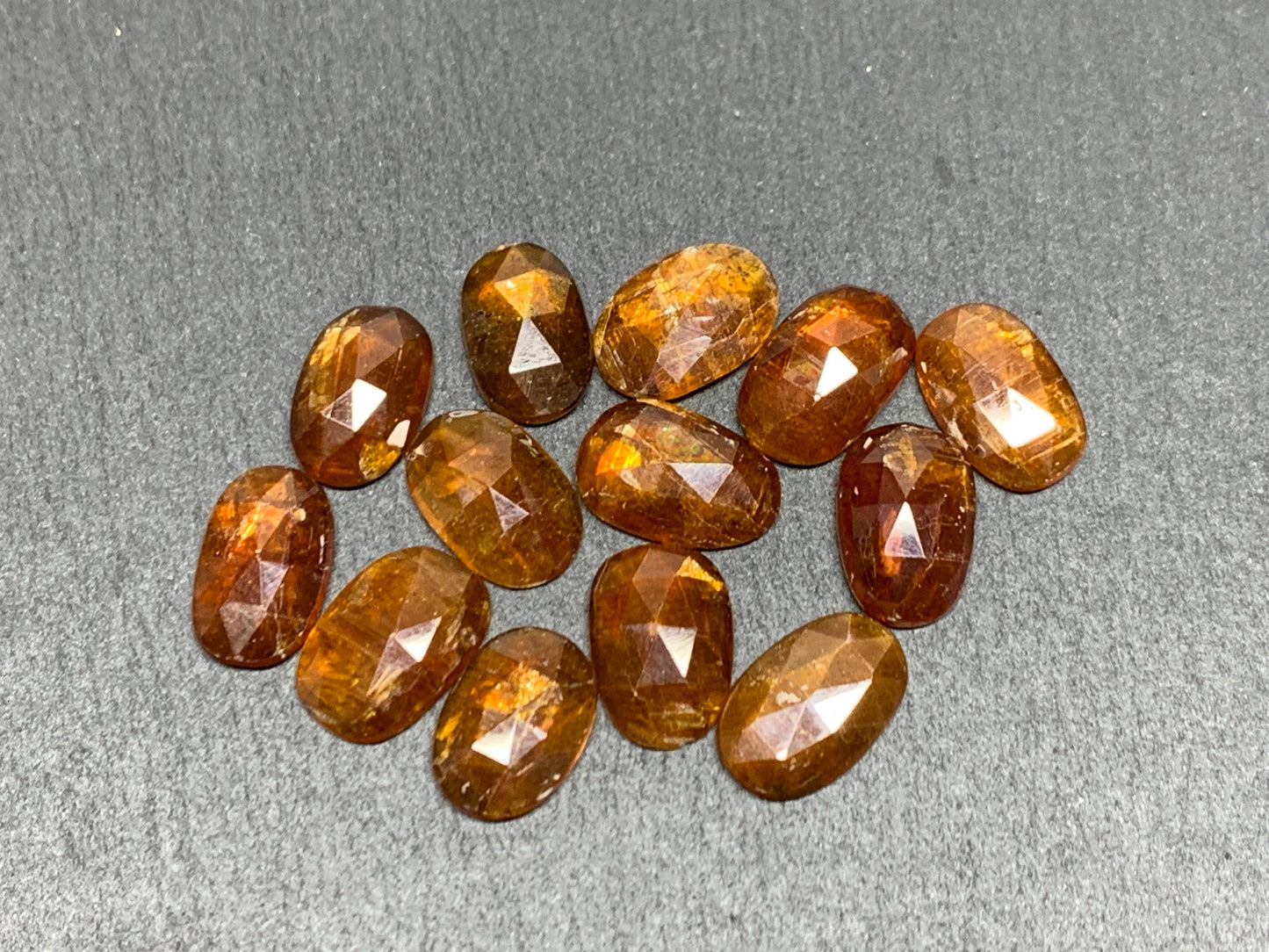 Damaged - faceted orange Kyanite oval 13mm long cabochons