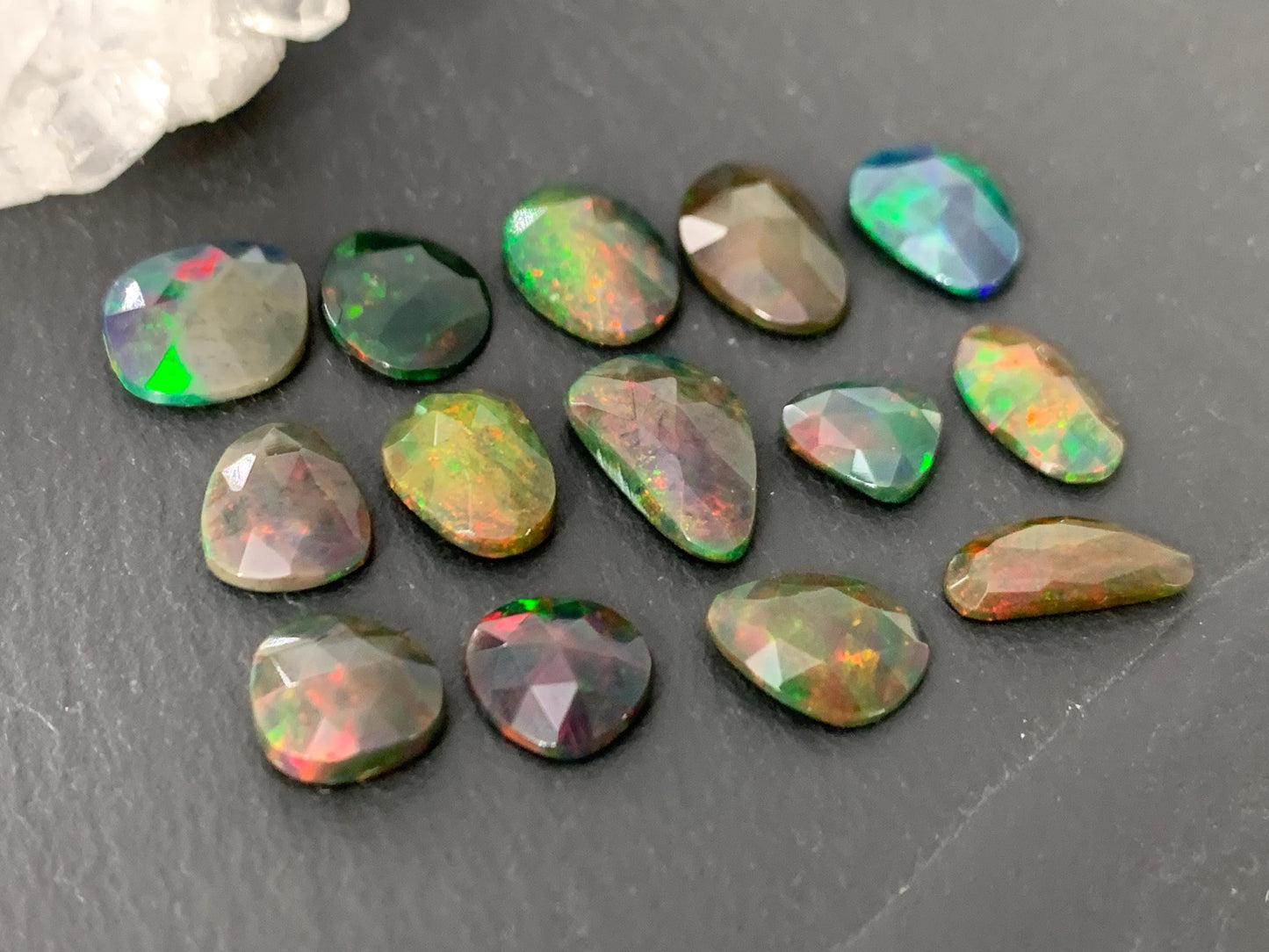 Faceted black Ethiopian Opal 8-12mm long cabochon