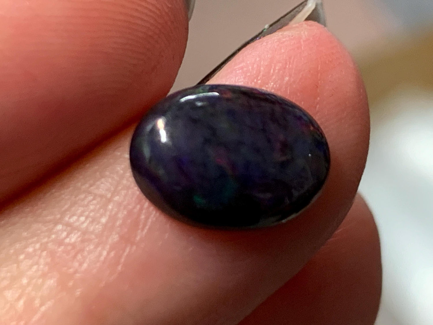 Natural Ethiopian Black Opal 9x11x5mm cabochon