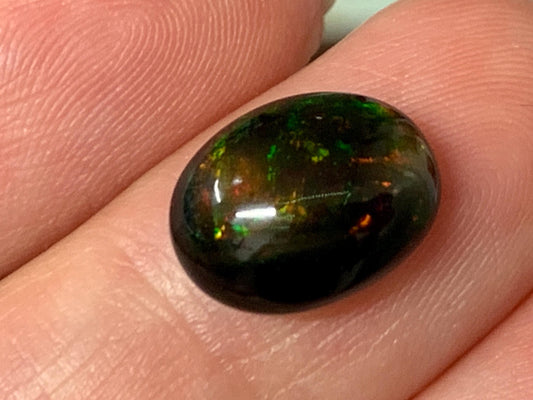 Natural Ethiopian Black Opal 9x12x5mm cabochon