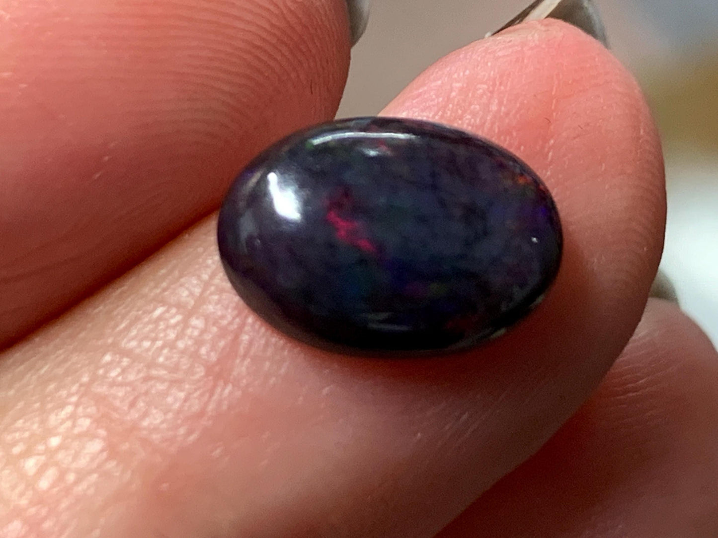 Natural Ethiopian Black Opal 9x11x5mm cabochon