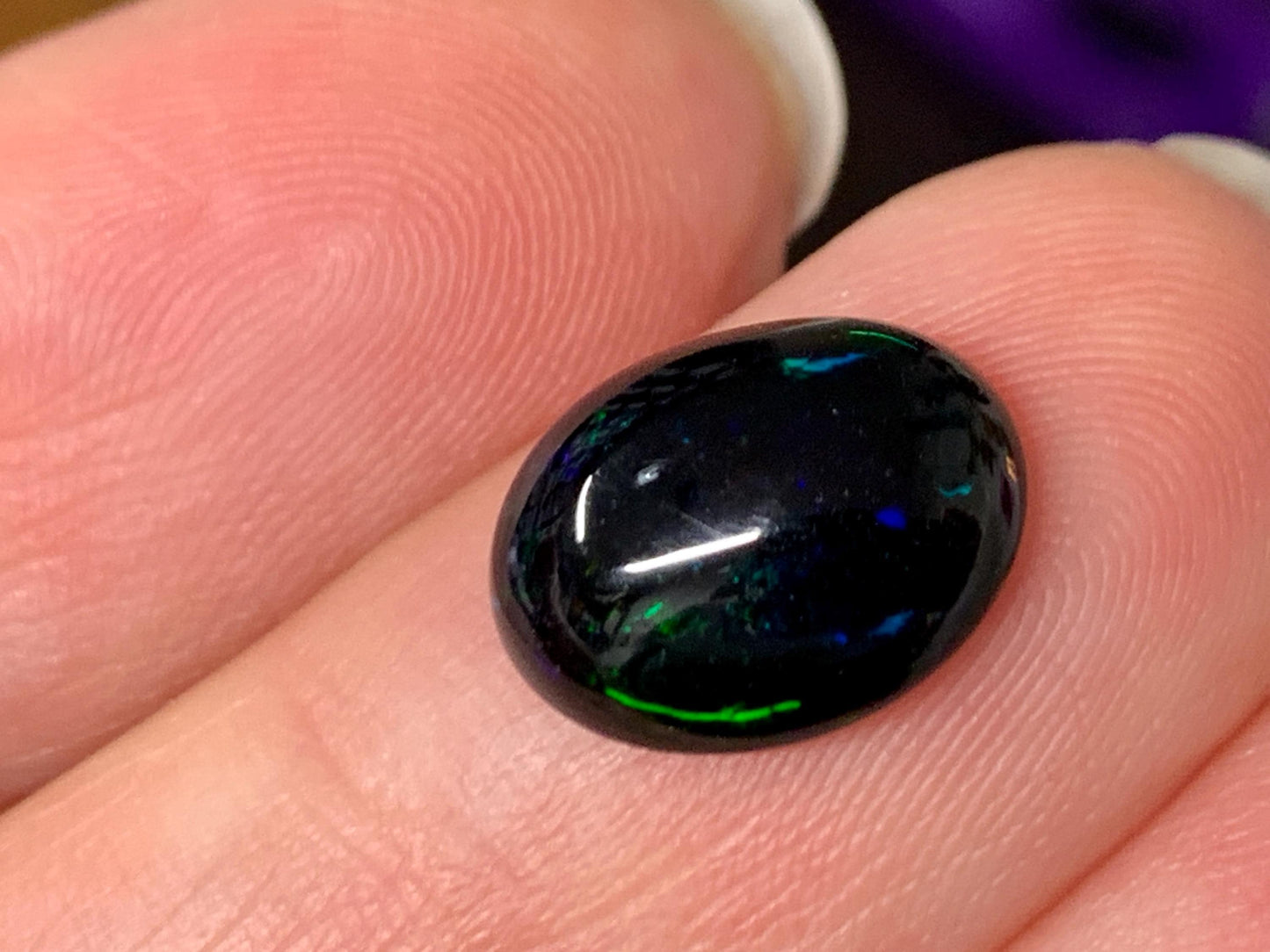 Natural Ethiopian Black Opal 9x11x4mm cabochon