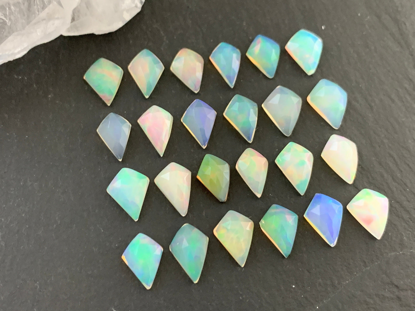 Faceted Welo Opal kite 7x9mm cabochon