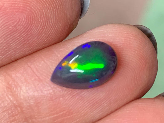 Natural Ethiopian Black Opal 7x11x4mm cabochon