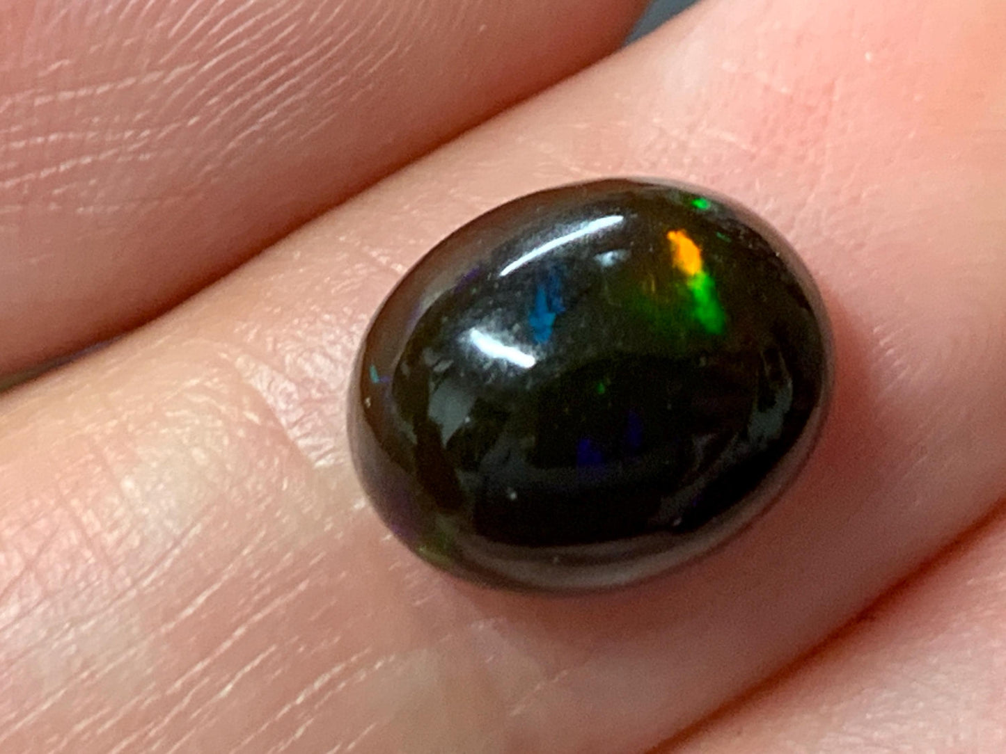 Natural Ethiopian Black Opal 9x11x5mm cabochon