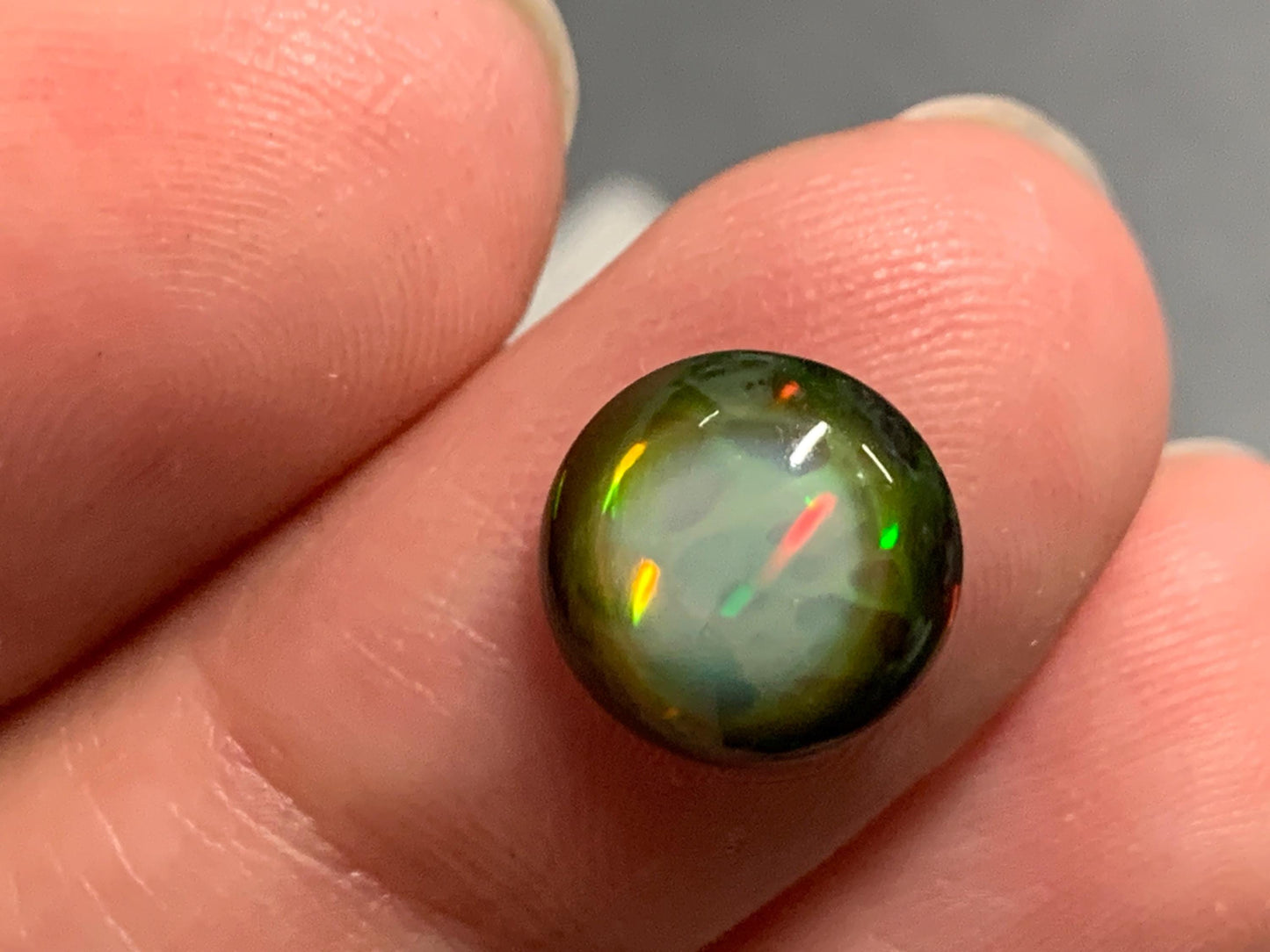 Natural Black Ethiopian Opal round 9.5x9.5x4mm cabochon