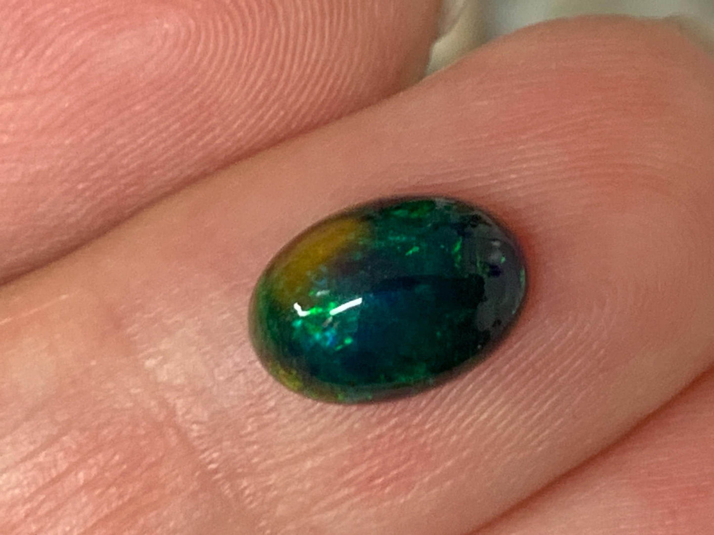 Natural Ethiopian Black Opal 6x9x3mm cabochon