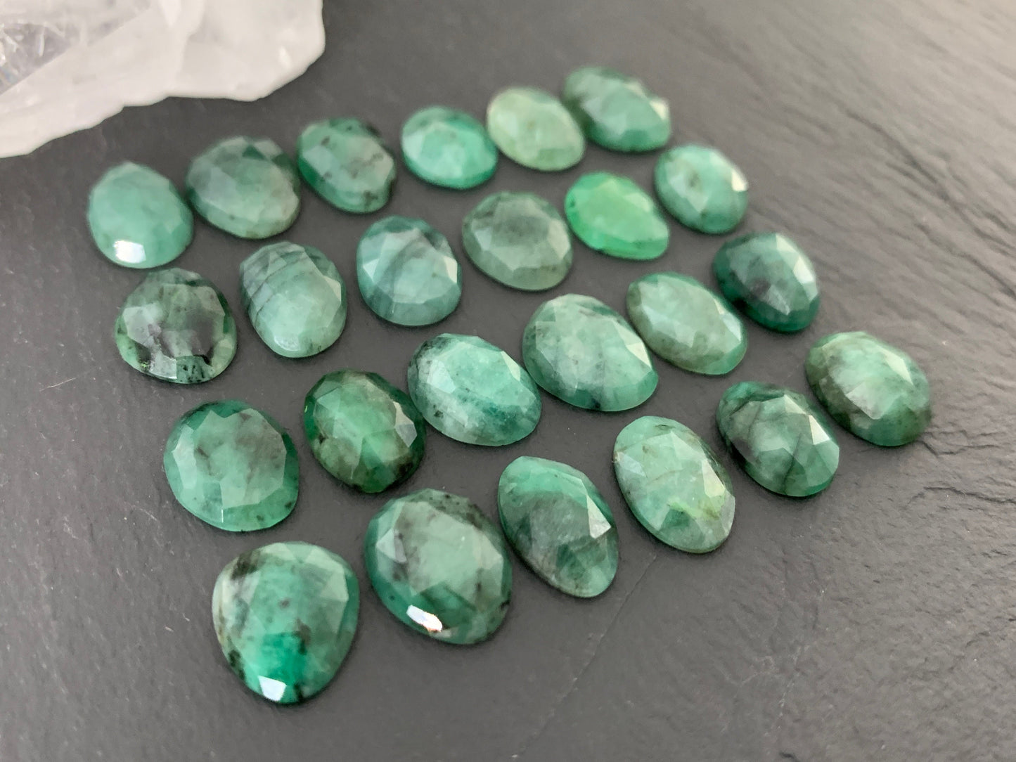 Faceted Emerald oval 11-13mm long cabochon