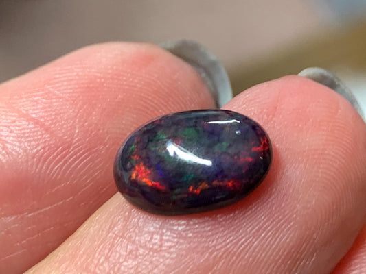 Natural Ethiopian Black Opal 9x11x5mm cabochon