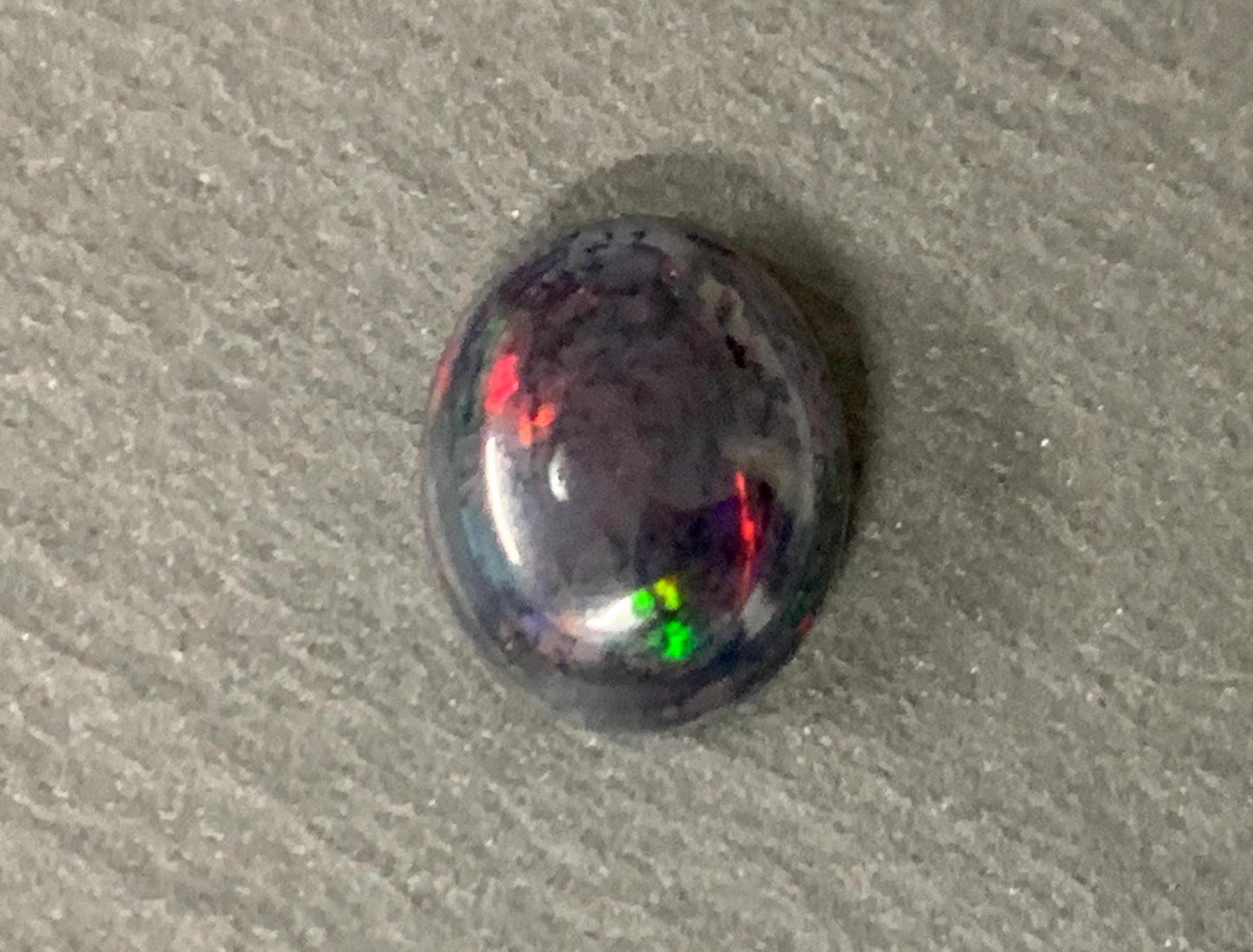 Black Ethiopian Opal 9x11x5mm cabochon