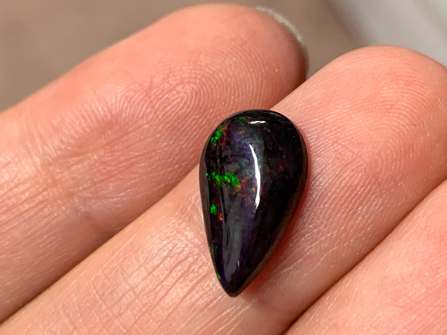 Black Ethiopian Opal pear 9x14x3mm cabochon