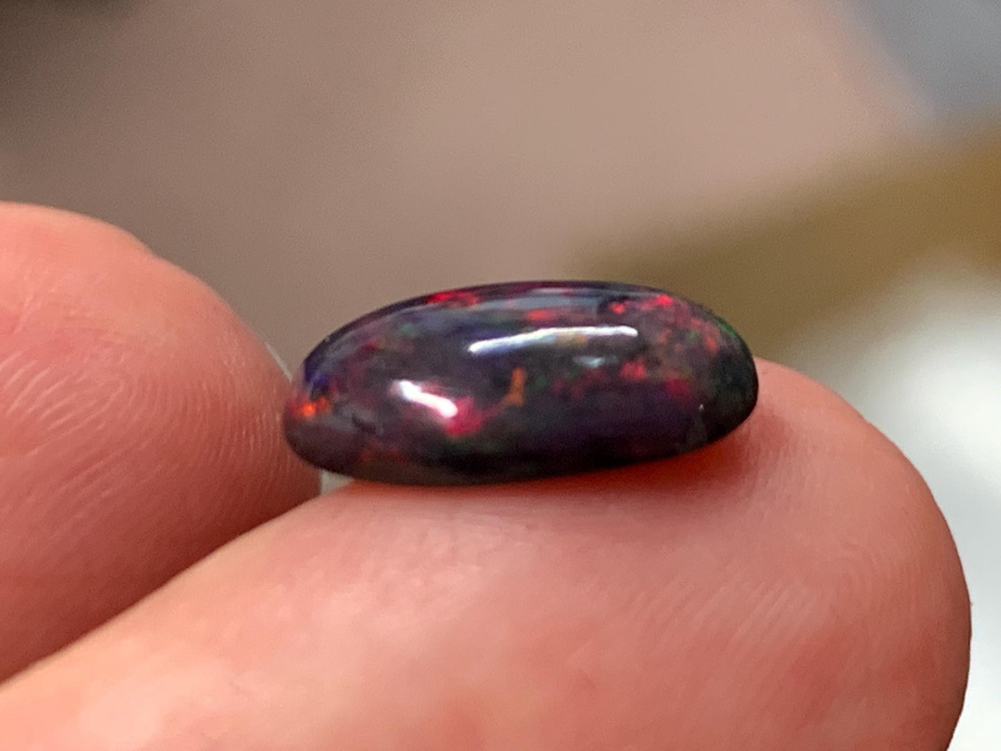 Natural Ethiopian Black Opal 9x11x5mm cabochon