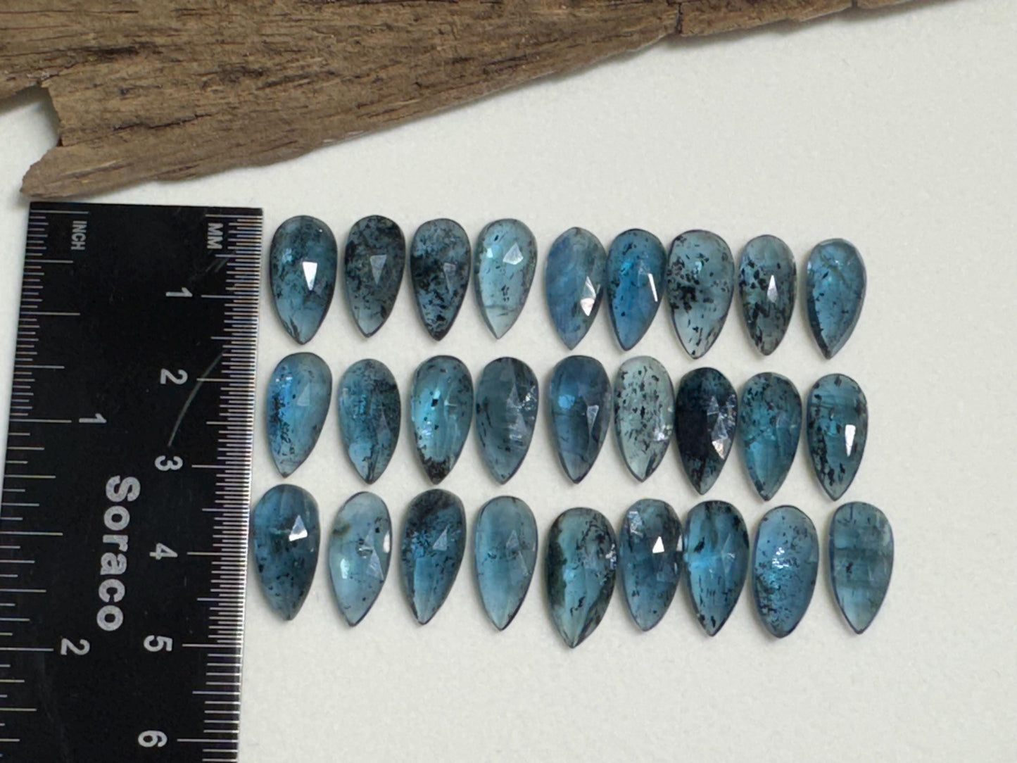 Faceted Moss Kyanite pear 7x15mm cabochon
