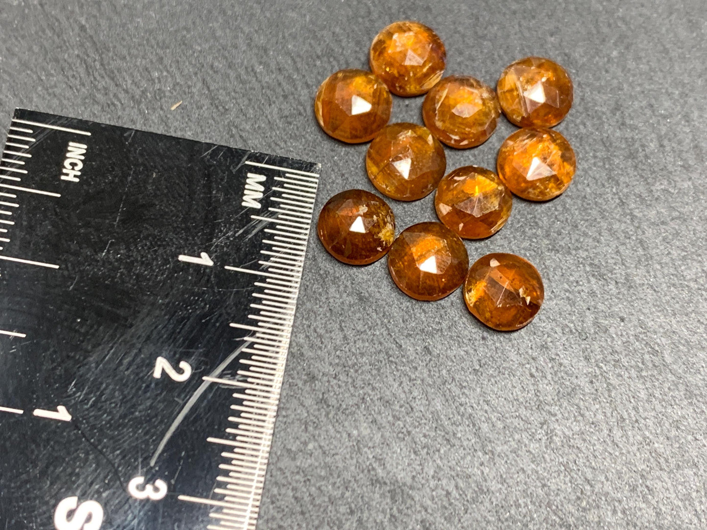Damaged - faceted orange Kyanite round 7mm cabochons