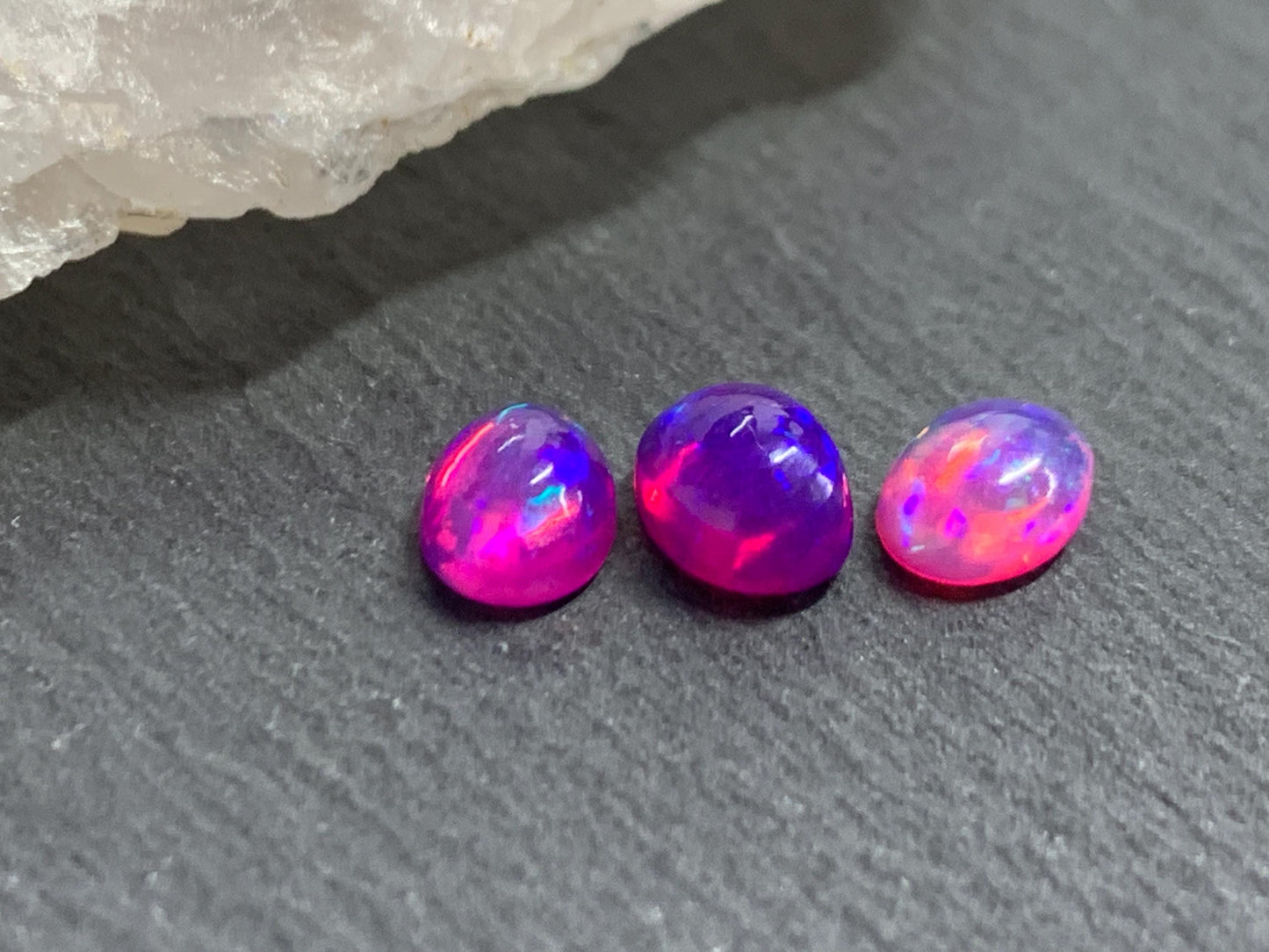 Ethiopian Opal oval 5x7mm cabochon - Natural Opal smoked to purple color