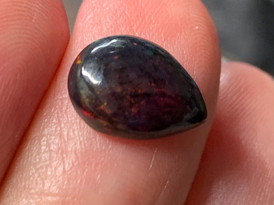 Natural Ethiopian Black Opal 8x11x4mm cabochon