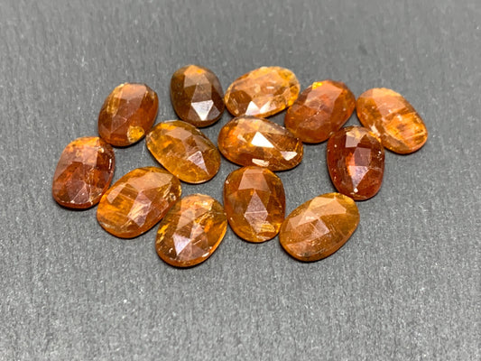 Damaged - faceted orange Kyanite oval 13mm long cabochons