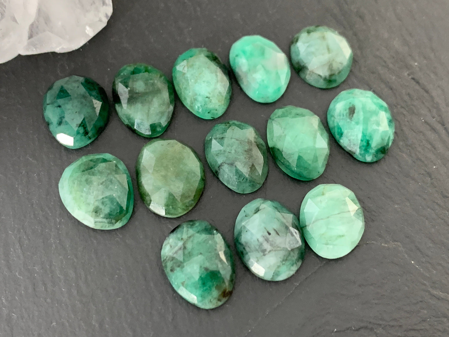 Faceted Emerald oval 12-13mm cabochon