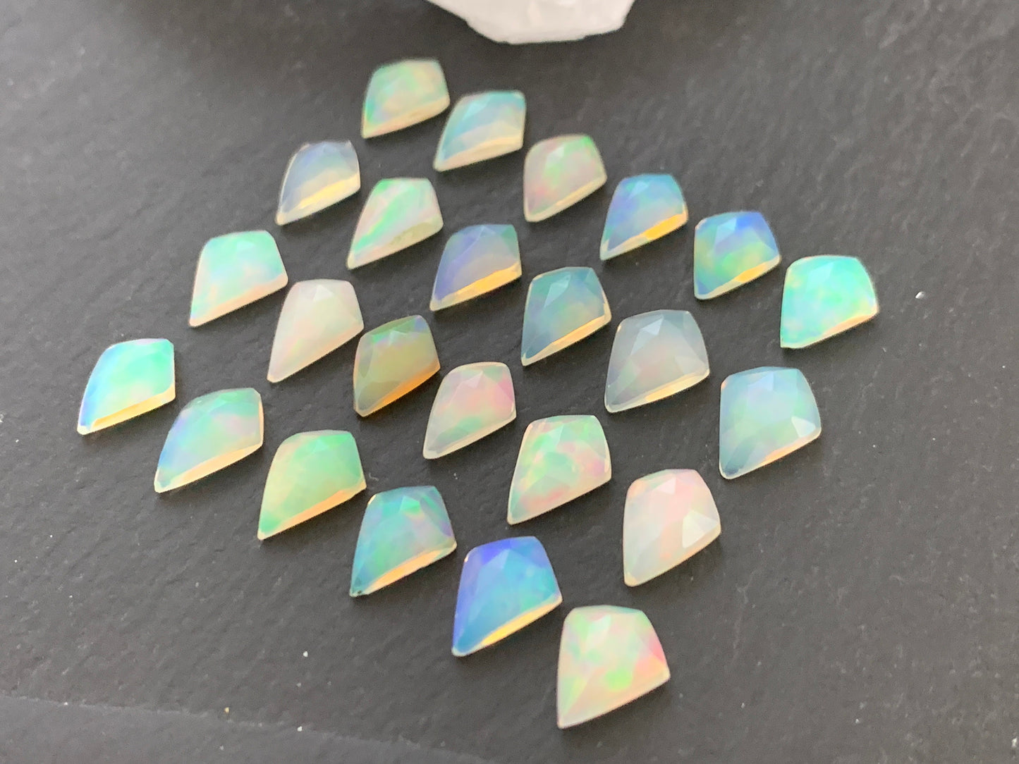 Faceted Welo Opal kite 7x9mm cabochon