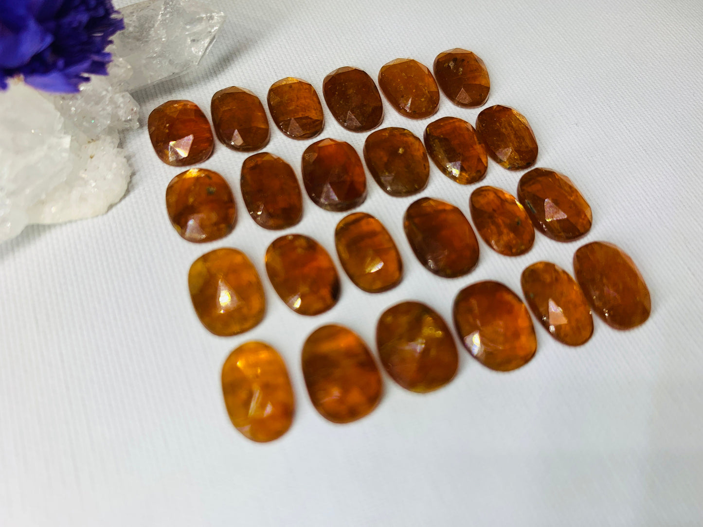 Faceted Orange Kyanite oval 10-11mm cabochon