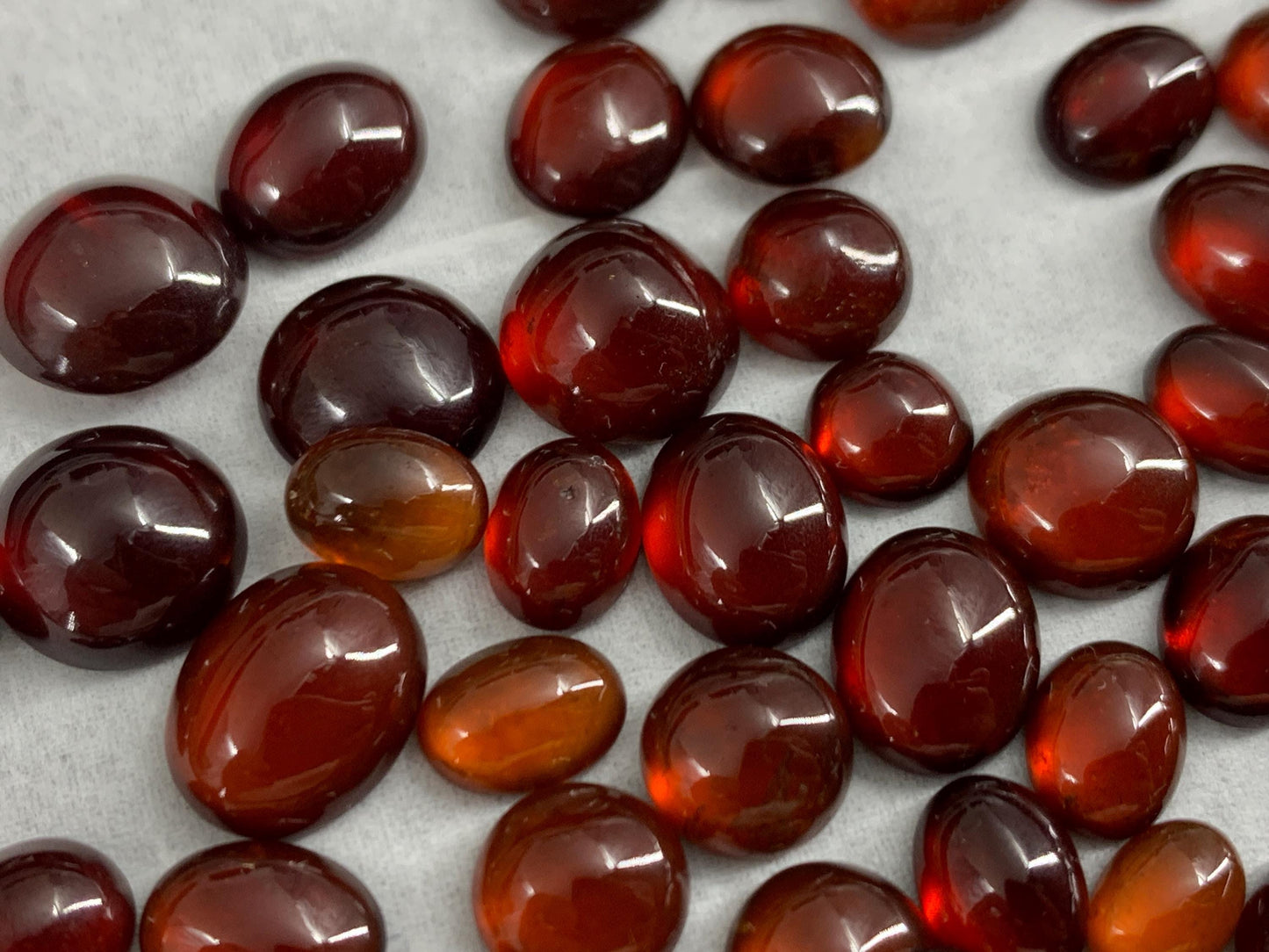 Hessonite Garnet oval, round 7-11mm long cabochon