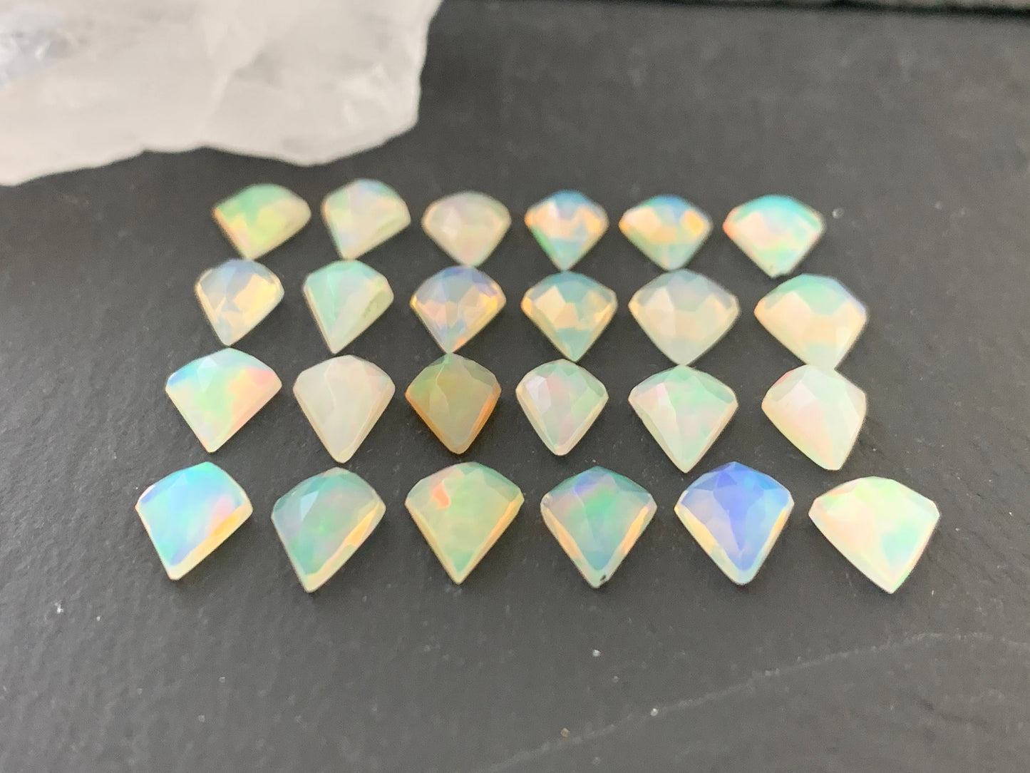 Faceted Welo Opal kite 7x9mm cabochon