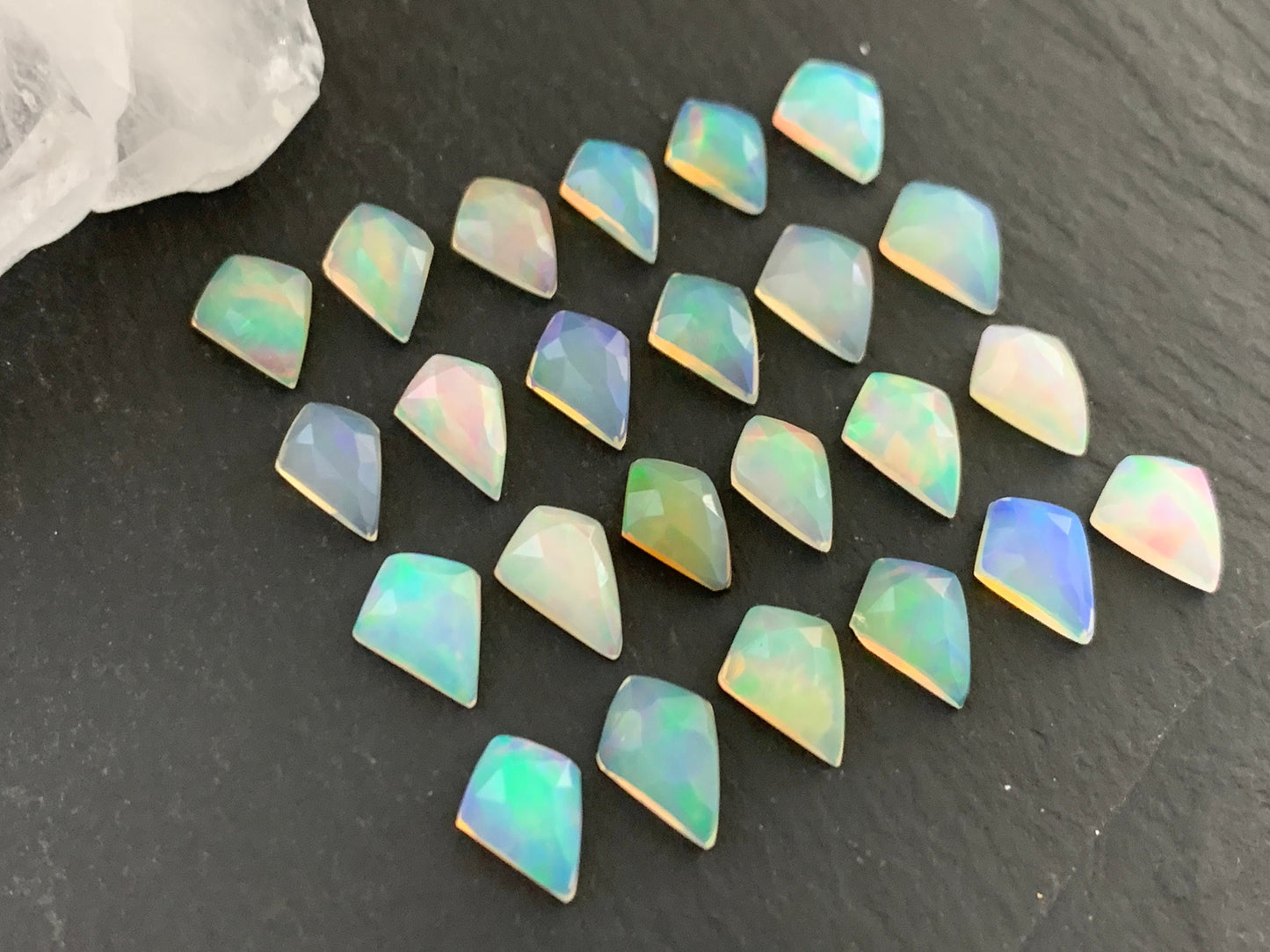 Faceted Welo Opal kite 7x9mm cabochon