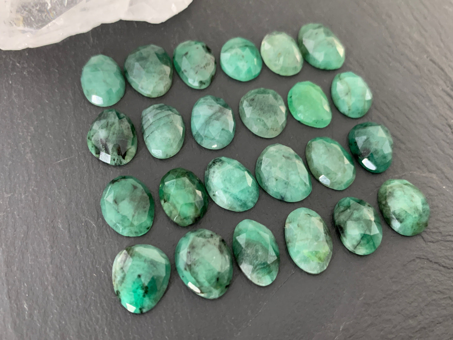 Faceted Emerald oval 11-13mm long cabochon