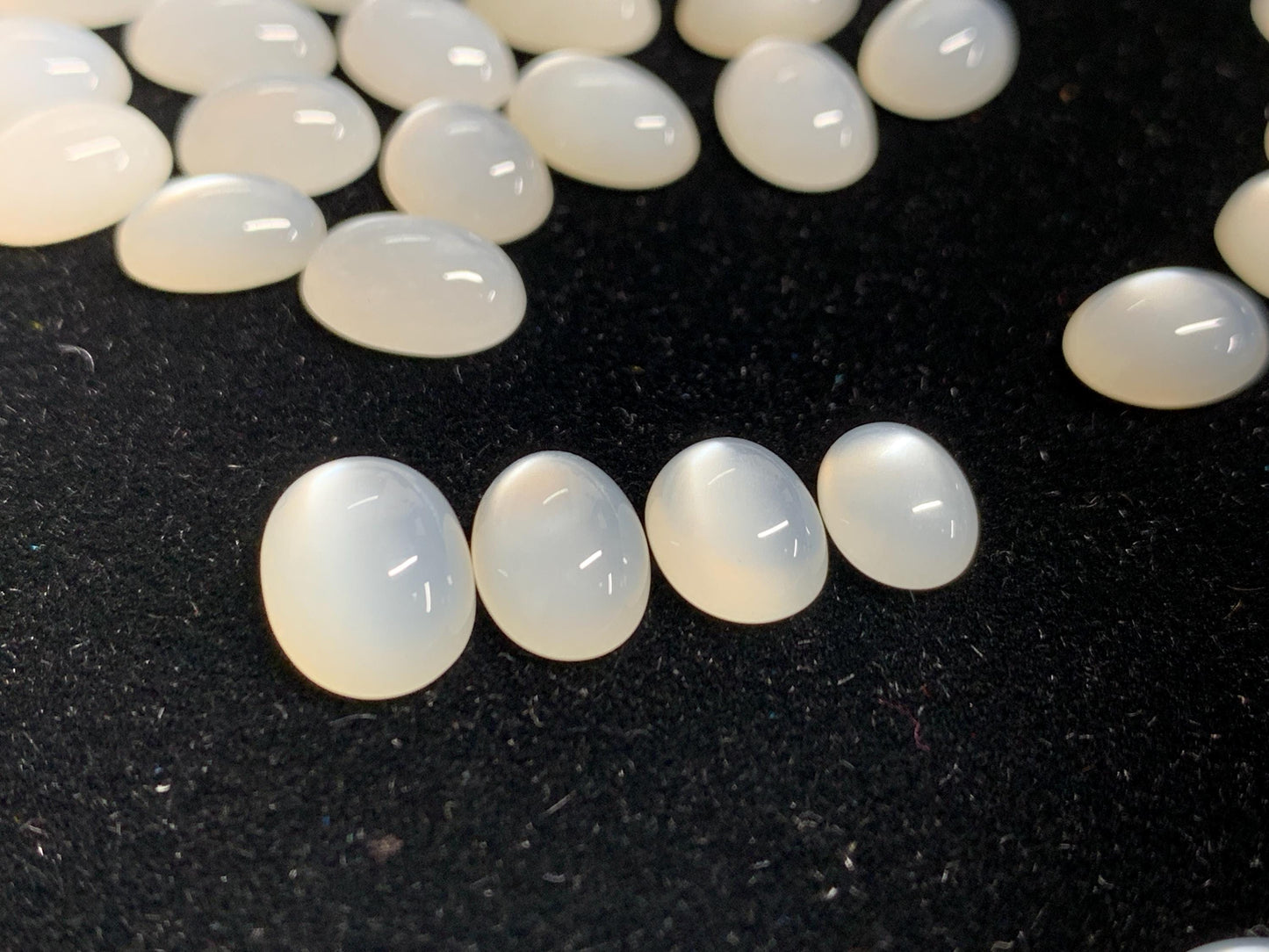 White Moonstone oval 8-11mm long cabochon
