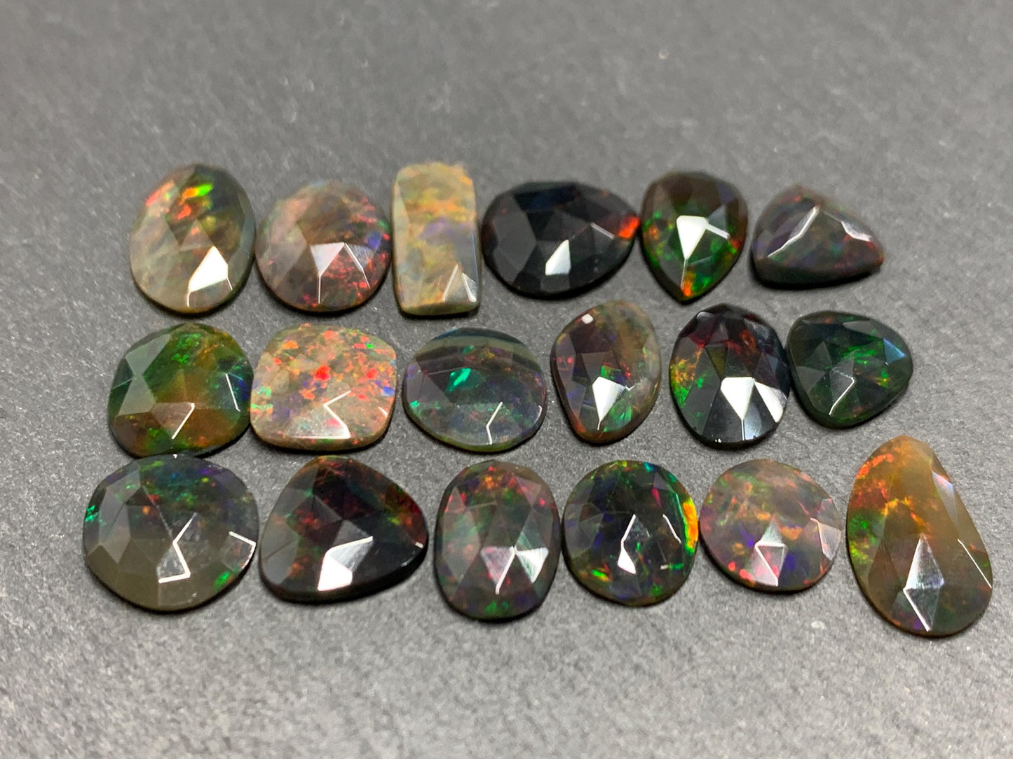 Faceted Black Opal oval 10-16mm long cabochon