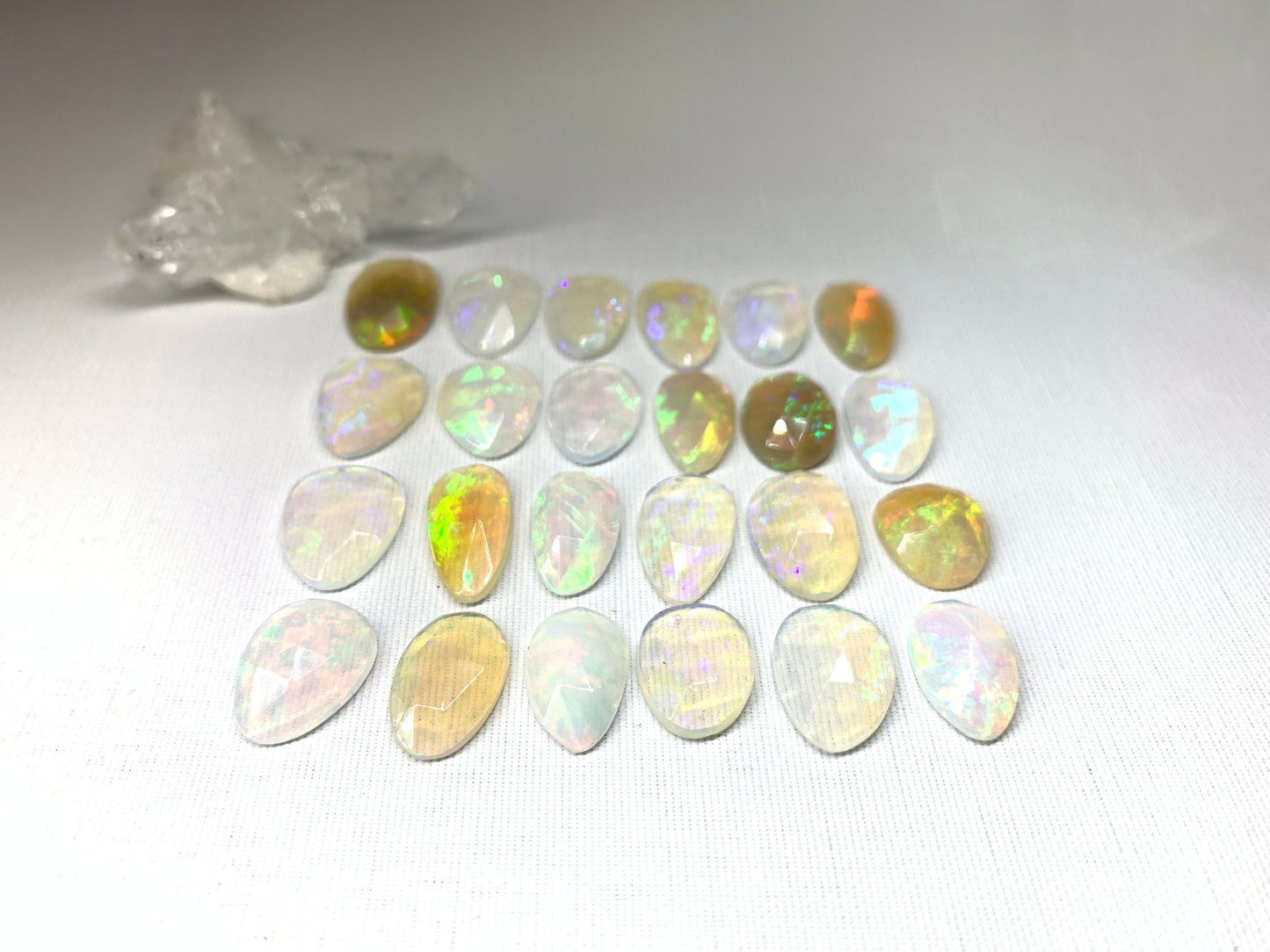 Faceted Ethiopian Opal 14-16mm cabochon