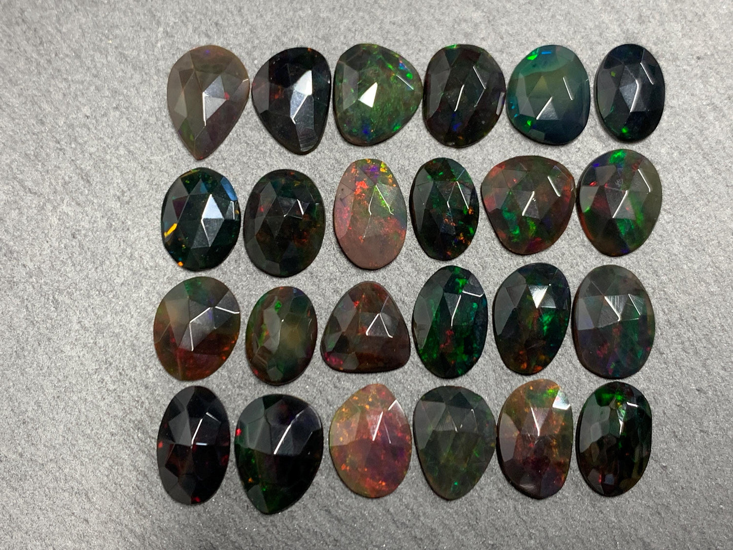 Faceted Black Ethiopian Opal 10-13mm long cabochon