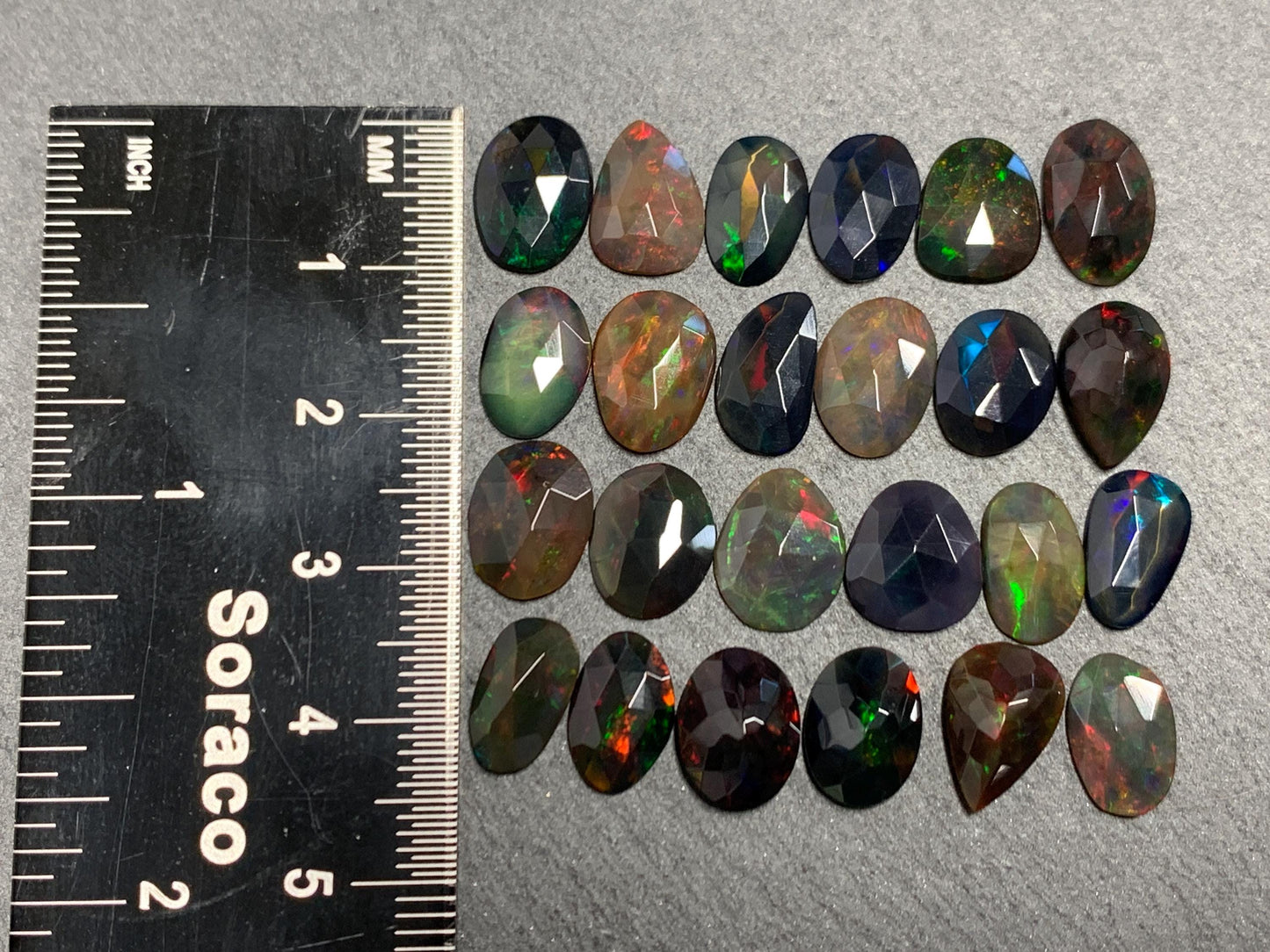 Faceted Black Ethiopian Opal 10-11mm long cabochon