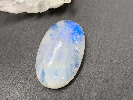 Rainbow Moonstone oval 33x21x9mm cabochon