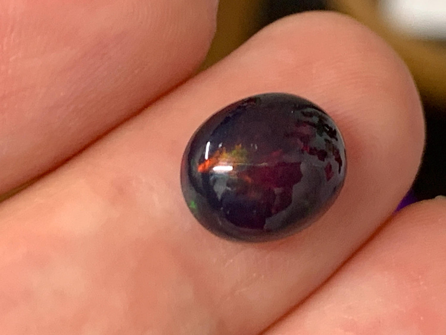 Natural Ethiopian Black Opal 8x10x5mm cabochon