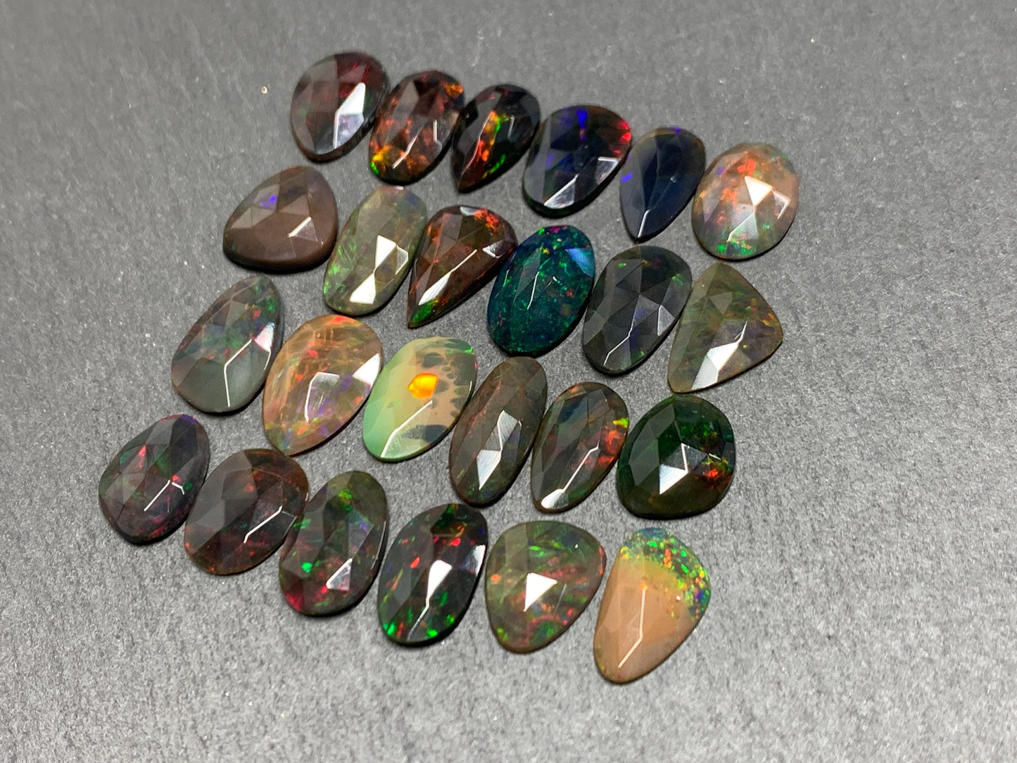 Faceted Black Opal 11-14mm long free form cabochon