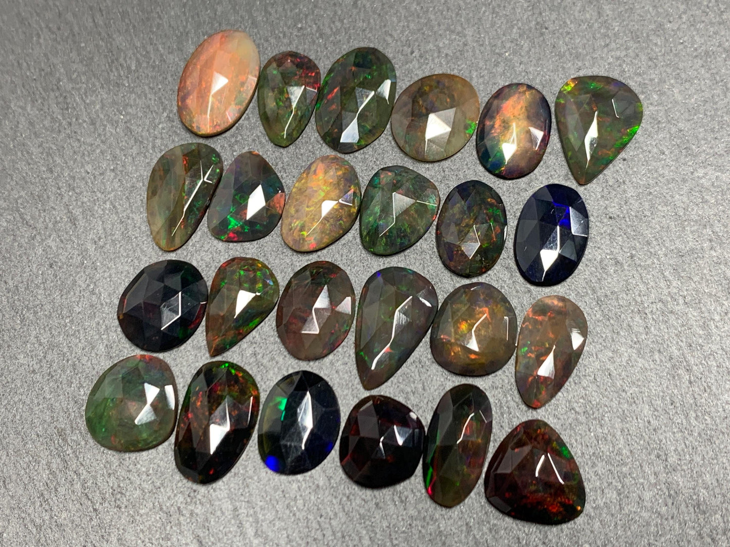 Faceted Black Ethiopian Opal 12-16mm long cabochon