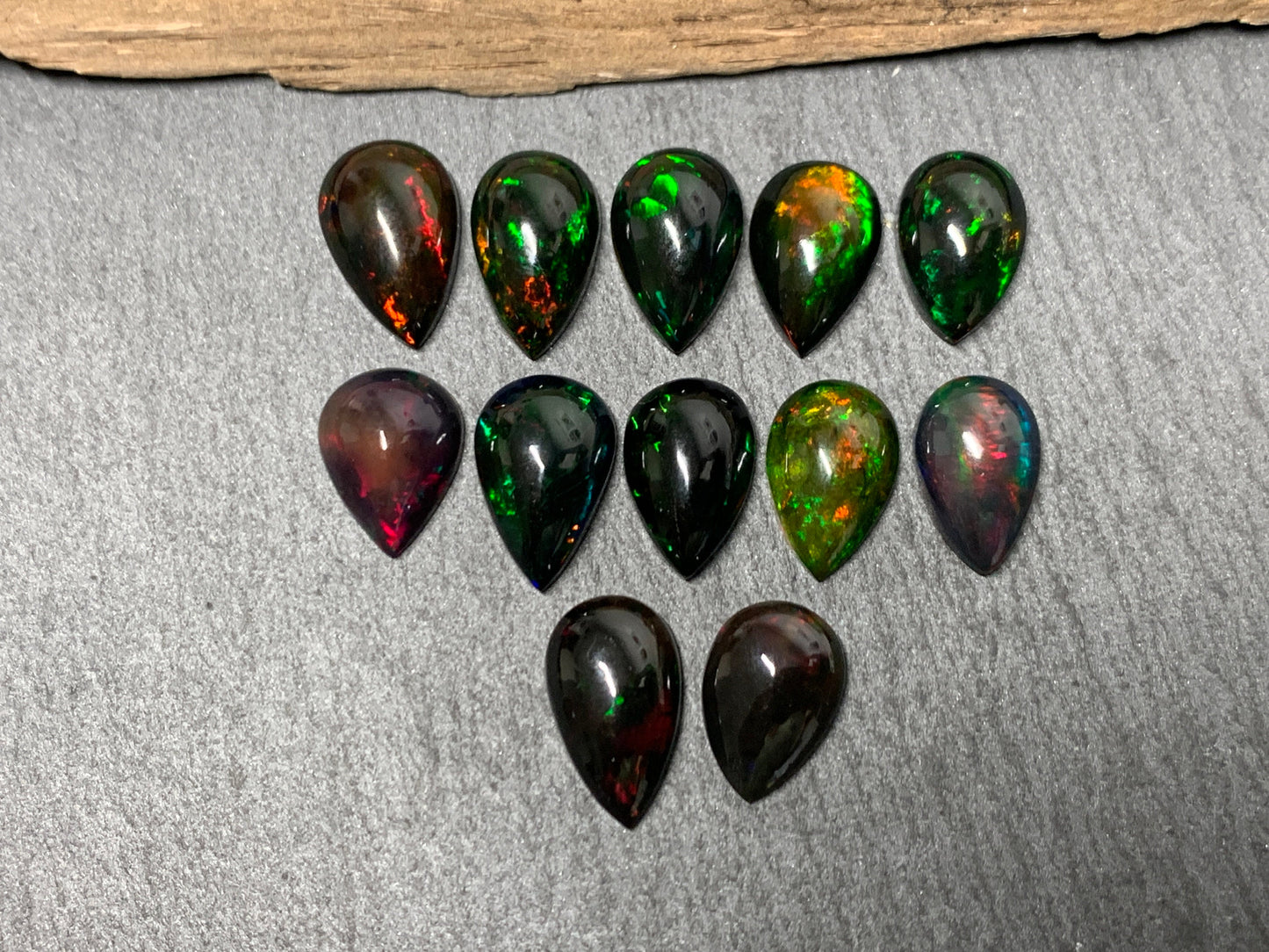 Black Ethiopian Opal pear 12-13mm long cabochon