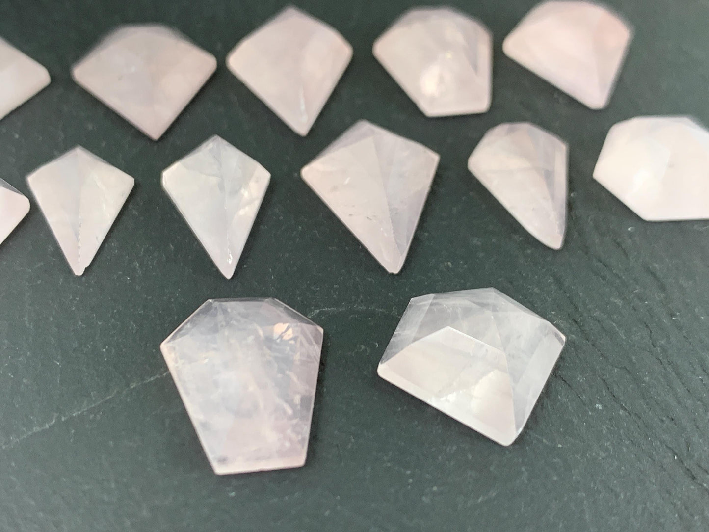 Faceted Rose Quartz step cut cabochon.
