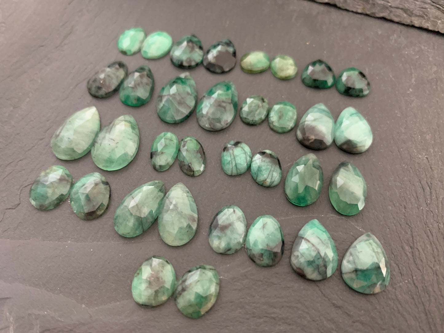 Faceted Emerald pair 9-19mm long cabochon